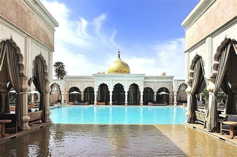 an indoor swimming pool in the middle of a building with arches and ...