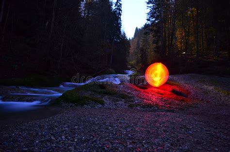 Glowing Red Orb beside Water Stock Image - Image of autumn, glowing ...