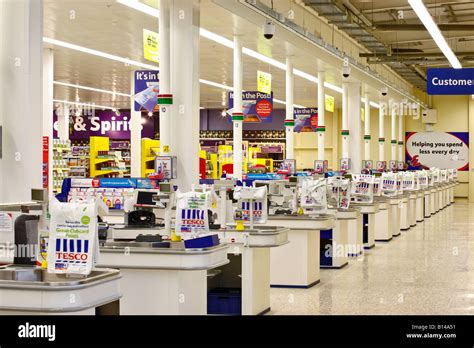 Supermarket checkout counters Stock Photo - Alamy