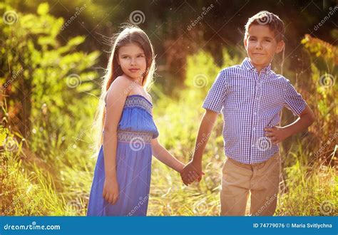 Beautiful Couple. Beauty Little Girl And Boy Holding Hands Stock Photo ...