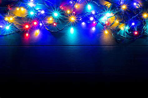 Christmas lights background with free text space. Glowing colorful ...