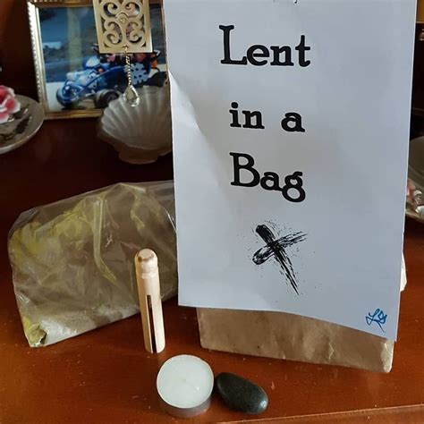 a sign that says lent in a bag next to some rocks and other items on a ...