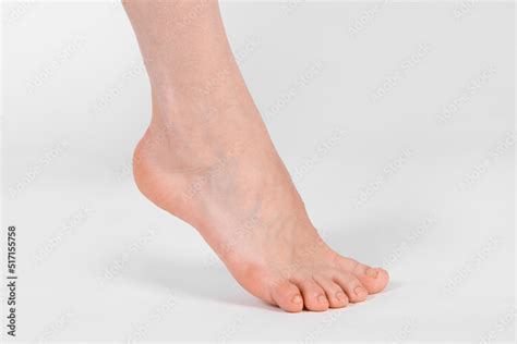 Barefoot and legs isolated on white background. Closeup shot of healthy ...