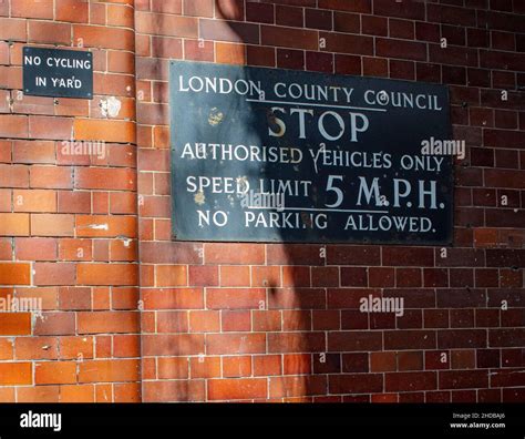 London County Council (LCC) STOP sign in central London; speed limit of ...