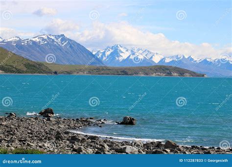 Lake Tekapo To Mountains with Snow on Peaks NZ Stock Image - Image of ...