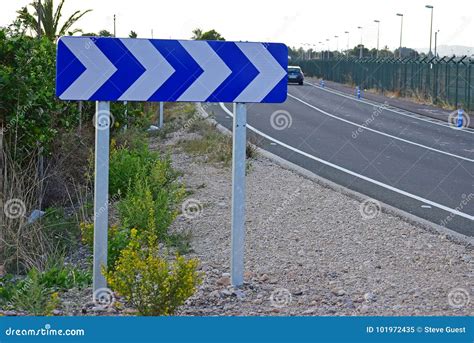 Chevron Road Sign on a Road Bend Stock Image - Image of chevron, tarmac ...