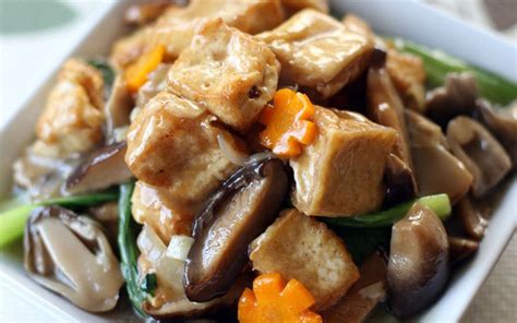 Deep fried tofu braised with mushrooms and vegetables in a savory ...