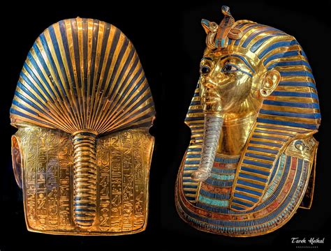 two gold and blue egyptian masks are shown in front of a black ...