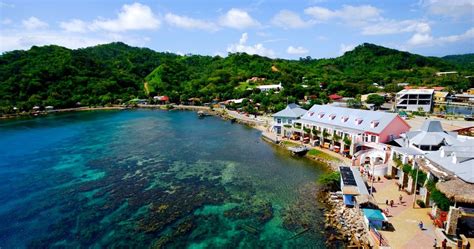 an aerial view of the resort and surrounding area with clear blue water ...