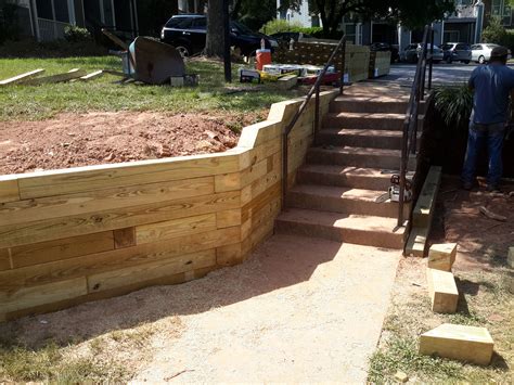 Stabilizing A Walkway With A Wooden Retaining Wall – Camden Landscape Group