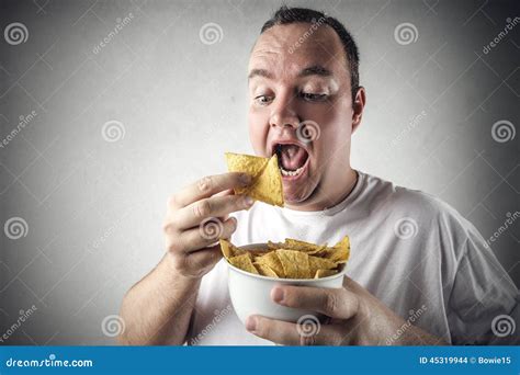 Man eating chips stock photo. Image of young, food, satisfied - 45319944