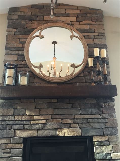 Stone fireplace round mirror arhaus | Mirror over fireplace, Fireplace ...