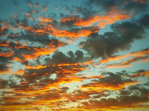 Glowing Clouds at Sunset Photograph by Sarah Bard - Pixels