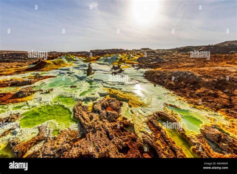 Acidic pools, mineral formations, salt deposits in the crater of Dallol ...