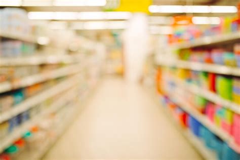 Premium Photo | Empty supermarket aisle and shelves in blurry for ...