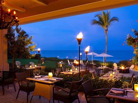 Terrace with tables overlooking the beach Baleen restaurant. Beachside ...