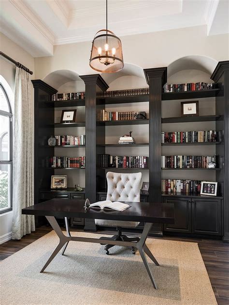 Modern Home Office with Built-in Bookcases and Leather Chair