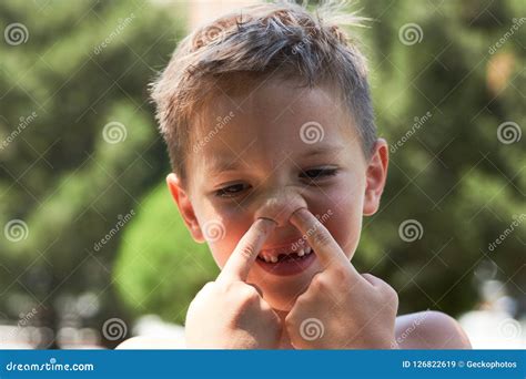 Ute Little Boy Enjoying Picking His Nose, Close-up. Stock Image - Image ...