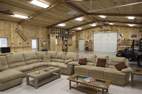 a living room filled with lots of couches and tables in front of a garage