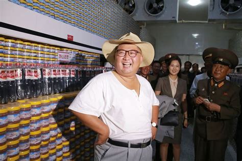 North Korea leader Kim Jong Un swaps Mao-style suit for summer clothes