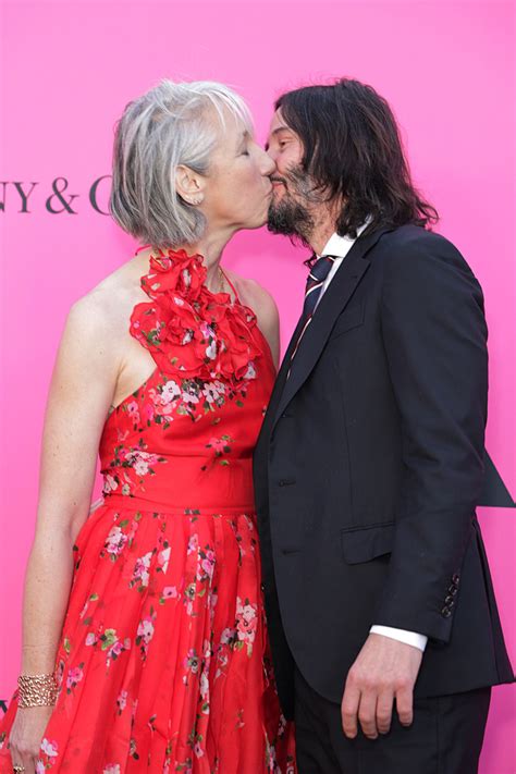 Keanu Reeves Shares A Kiss With Alexandra Grant On Red Carpet