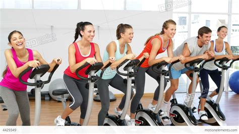 Spinning Class In Fitness Studio Stock video footage | 4429349