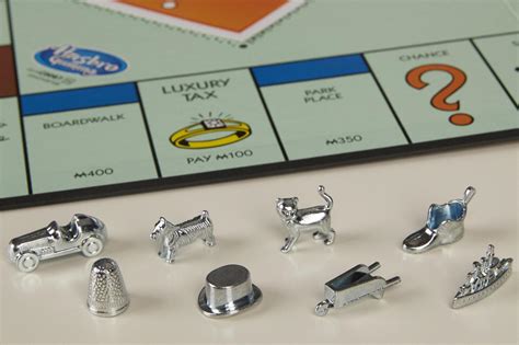 What are the original Monopoly pieces and how many different versions ...