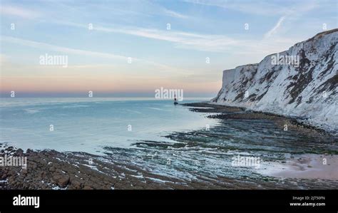 Beautiful Summer sunrise landscape image of Beachy Head Lighthouse in ...