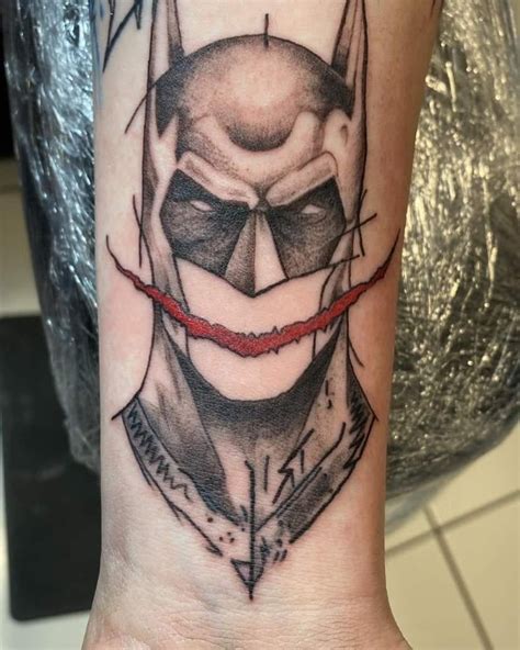 Batman with Joker smile tattoo done by Mike at Blasted Ink in ...