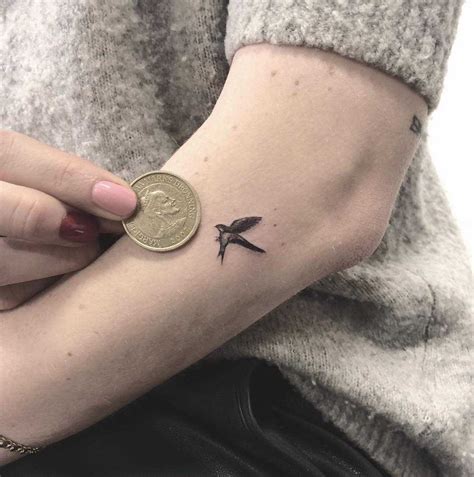 Micro swallow tattoo by Annelie Fransson - Tattoogrid.net