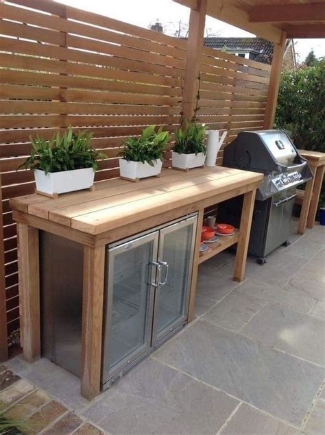 outdoor kitchen ideas wooden table with fridge and barbecue grill three ...