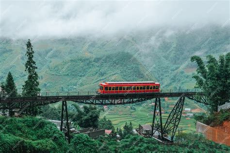 Premium Photo | Red train while going to cable car to the top of the ...