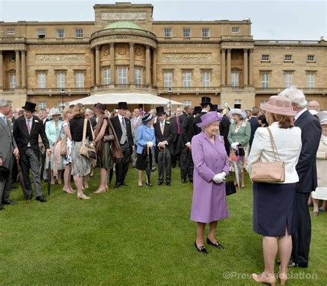 Guests meet The Queen at a garden party at Buckingham Palace, 21 May ...