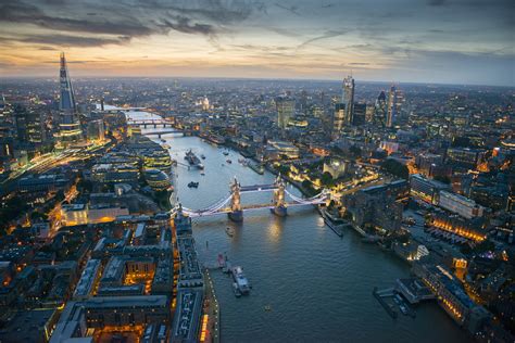 Aerial view of Tower Bridge and the River Thames at night, London ...