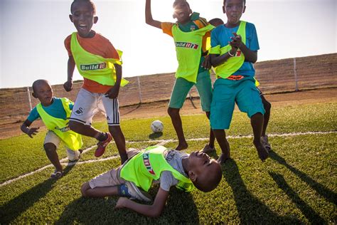 Playing Soccer in an African Village - Micato Luxury Africa Safaris