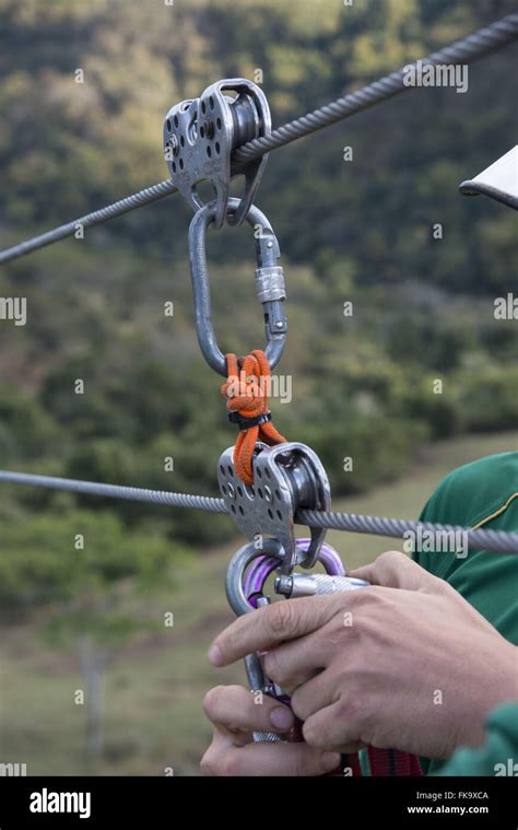 Conductor preparing equipment for practice zipline Stock Photo - Alamy