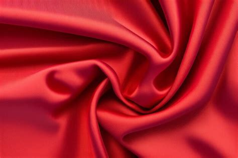 Premium Photo | Red silk fabric with a soft, silky finish.