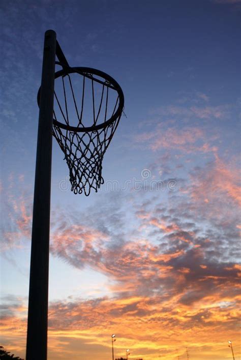 Netball net and sunset. A beautiful sunset in the background with a ...