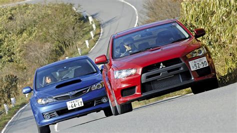 Mitsubishi Lancer Evo X vs Subaru Impreza WRX STI | Auto Express