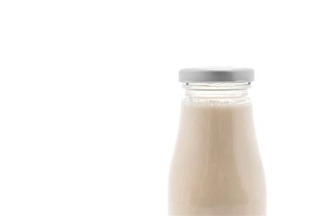 Premium Photo | Milk in bottle on white