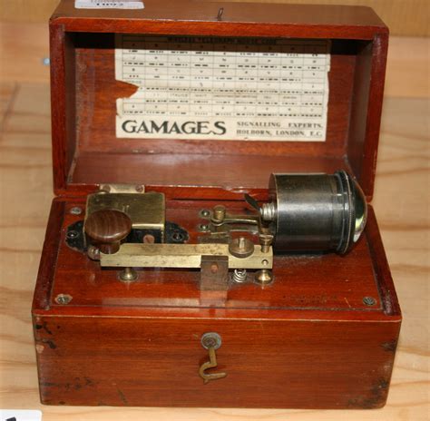 An A.W. Gamage Ltd wireless telegraph Morse code machine within a ...