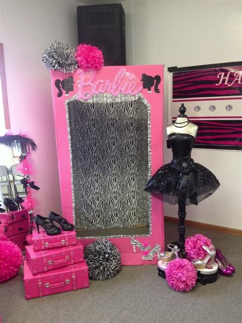 a room with pink and black decorations and a mirror