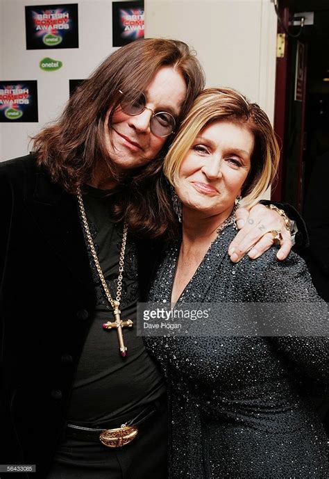 two women pose for the camera at an event