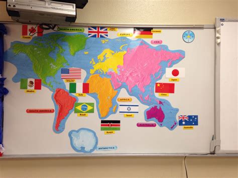 7 continents (taped on) and some of their countries flags (magnets ...