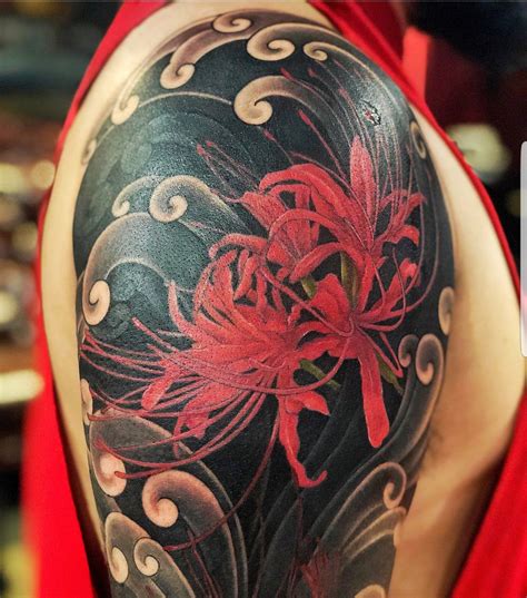 Red spider Lily tattoo with traditional Japanese clouds | Lily tattoo ...