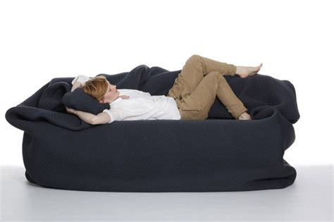 A Bean Bag Bed With Built-in Blanket and Pillow