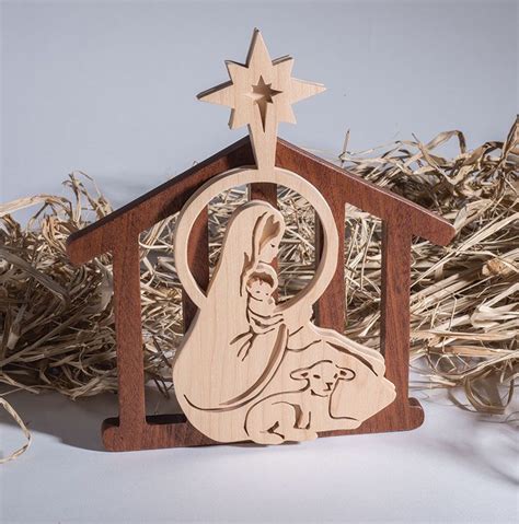 This 3-D nativity scene by Sue Mey uses a layered design to add depth ...