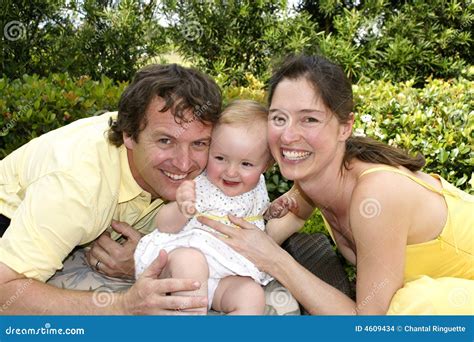 Smiling happy family stock photo. Image of baby, yellow - 4609434