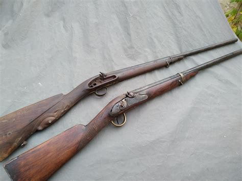 Two old shotguns from early 1800's, the one in the front is prussian ...