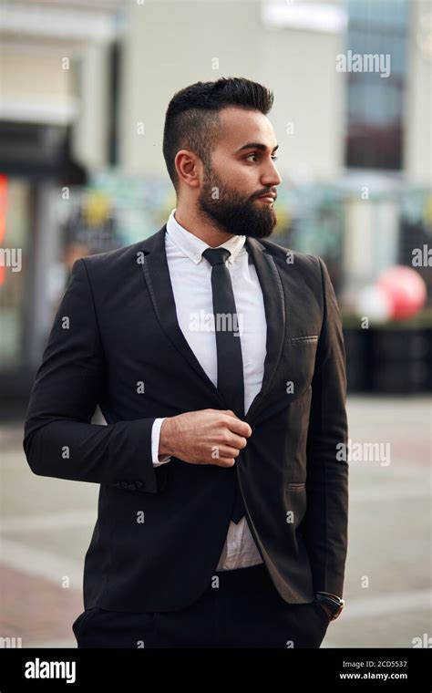 Side view on handsome rich man in suit looking away. Office male with ...